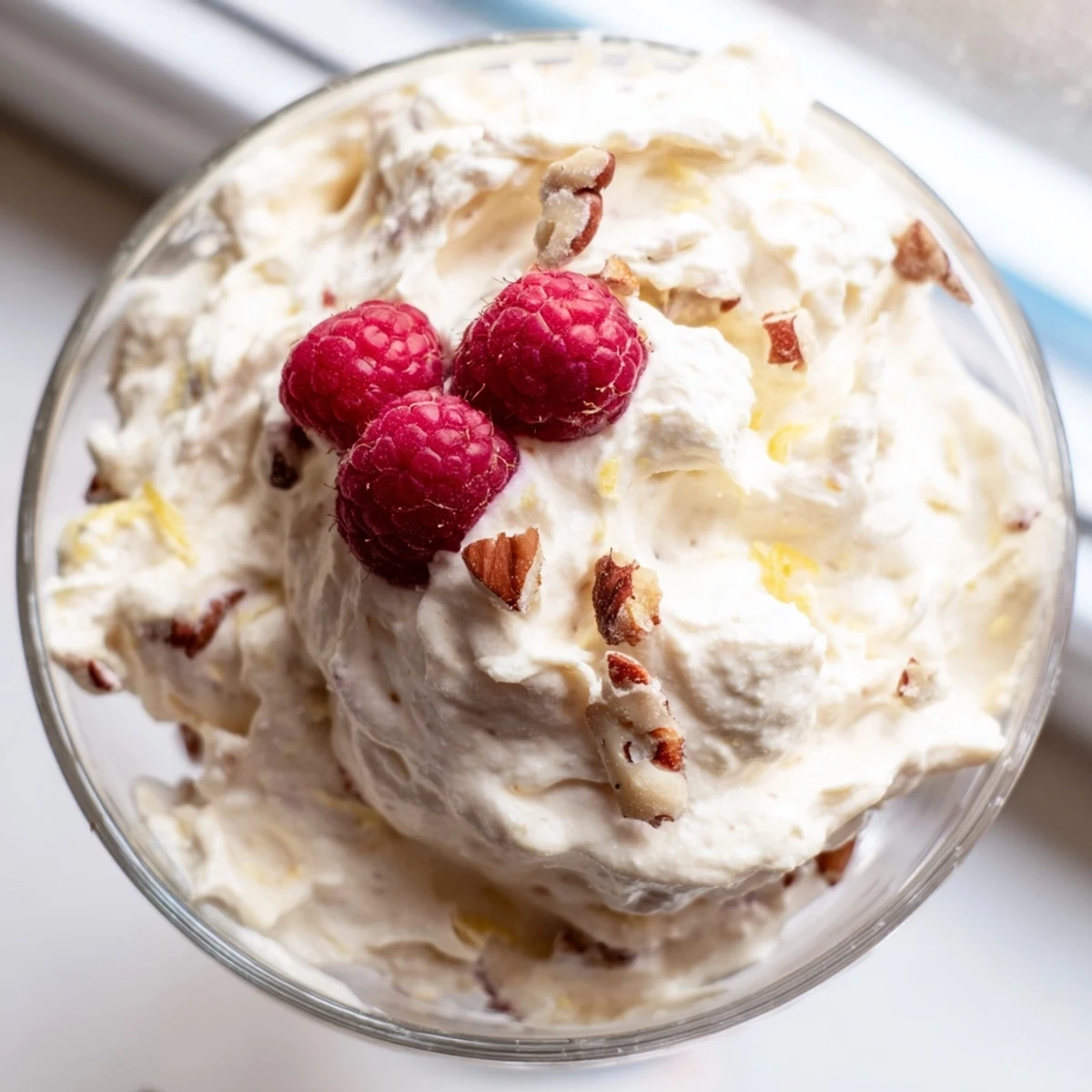 Light and airy keto cheesecake fluff swirled with vanilla in small serving dishes