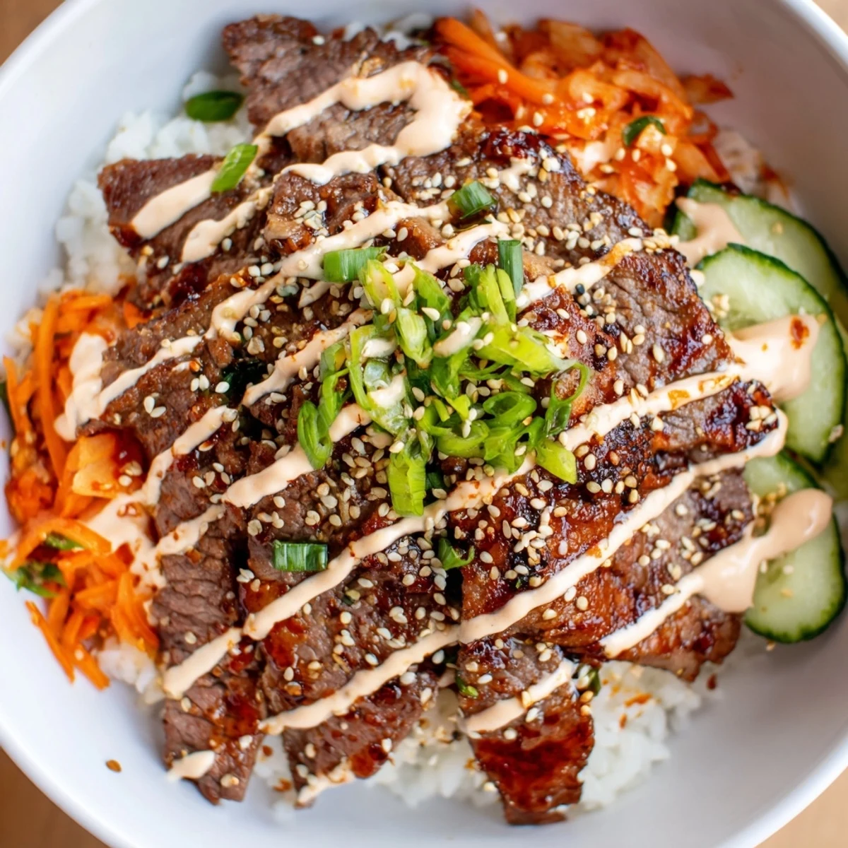 A generous portion of Korean BBQ steak rice bowls with kimchi and sesame seeds