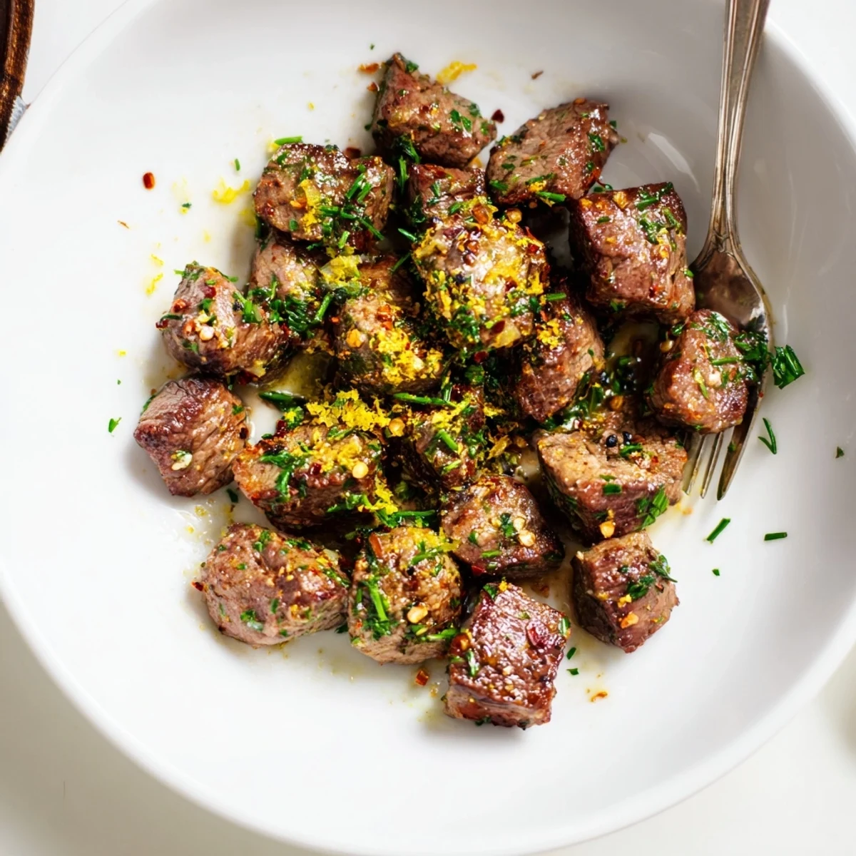 Pan seared Cowboy Butter Steak Bites Recipe tossed in zesty garlic chive sauce