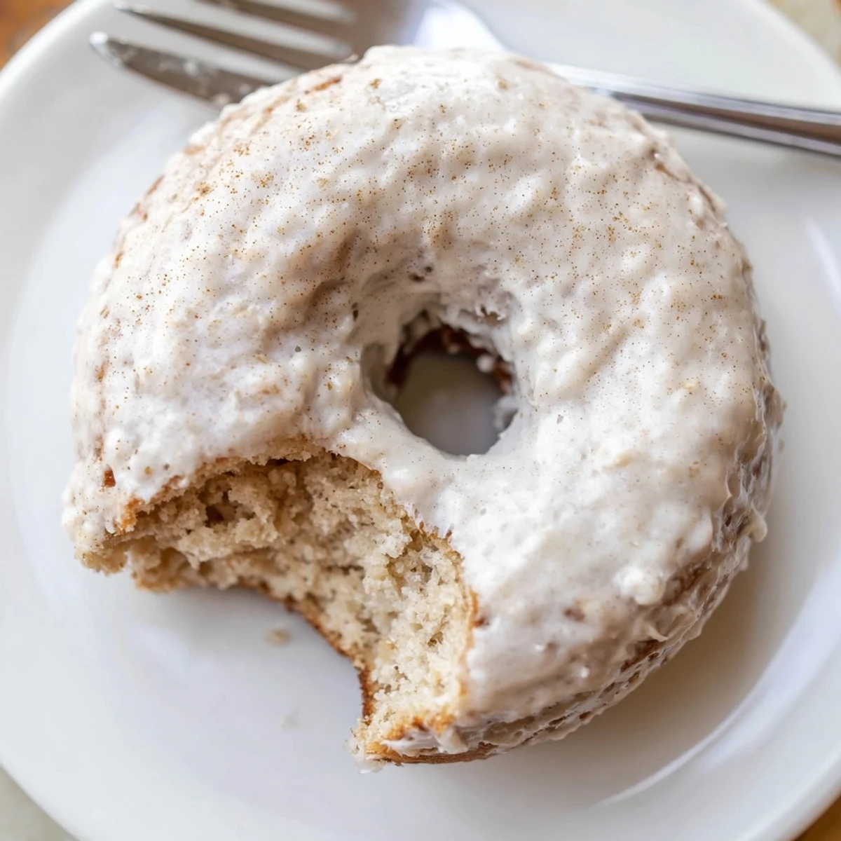 Golden, moist Banana Donuts cooling on a wire rack, warm banana aroma